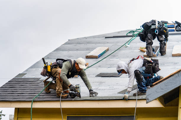 Professional Roofing technician working in Kingsley, MI
